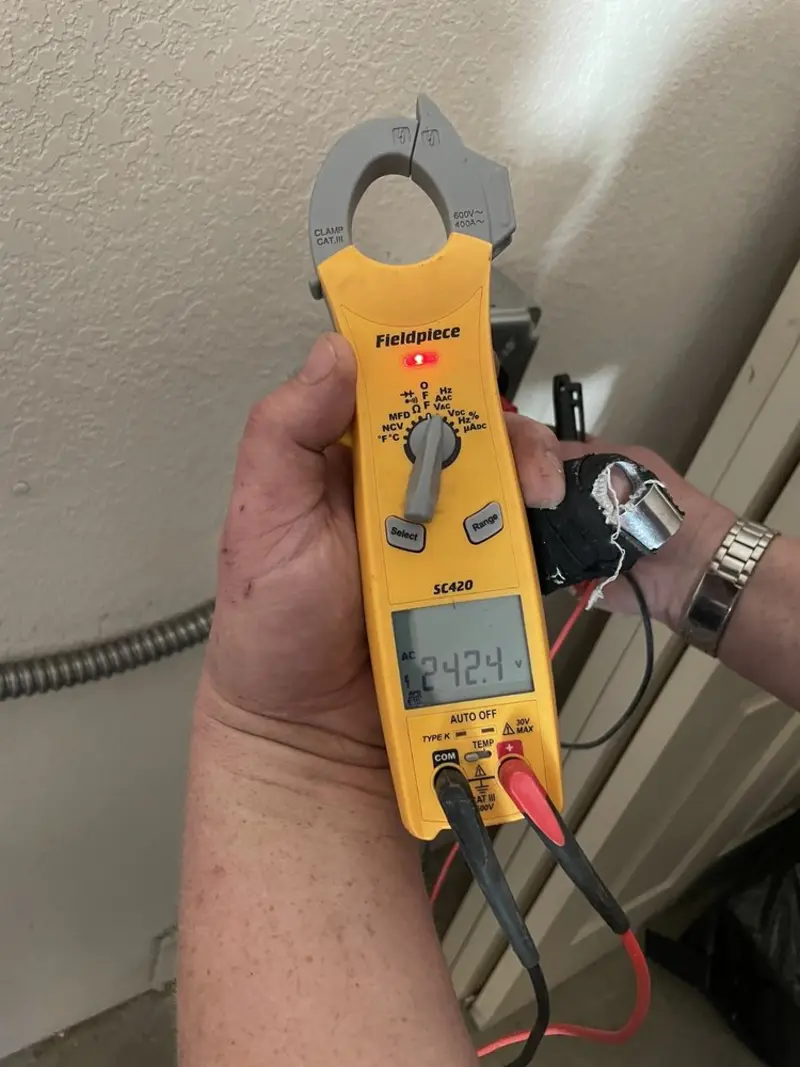 Voltage testing with clamp meter during Whole House Surge Protector in Tifton